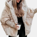Beige puffer jacket with hood, faux-fur trim, snap placket, and ribbed inner cuffs