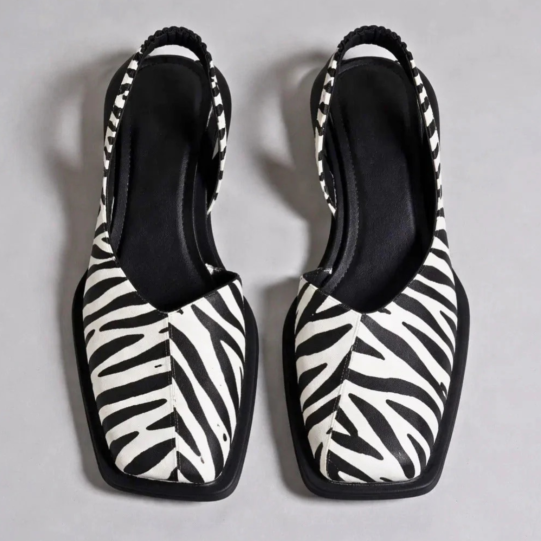 Pair of Emanuela square-toe moccasins with zebra-print uppers and black outsole