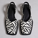 Pair of Emanuela square-toe moccasins with zebra-print uppers and black outsole