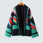 Quilted jacket with navy base, colorful geometric panels, full zip and stand collar