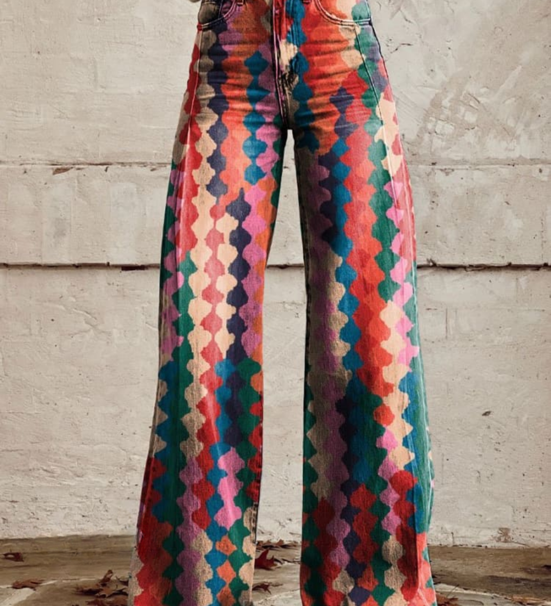 Women's wide-leg patterned trousers with colorful geometric print and button-front detail