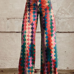 Women's wide-leg patterned trousers with colorful geometric print and button-front detail