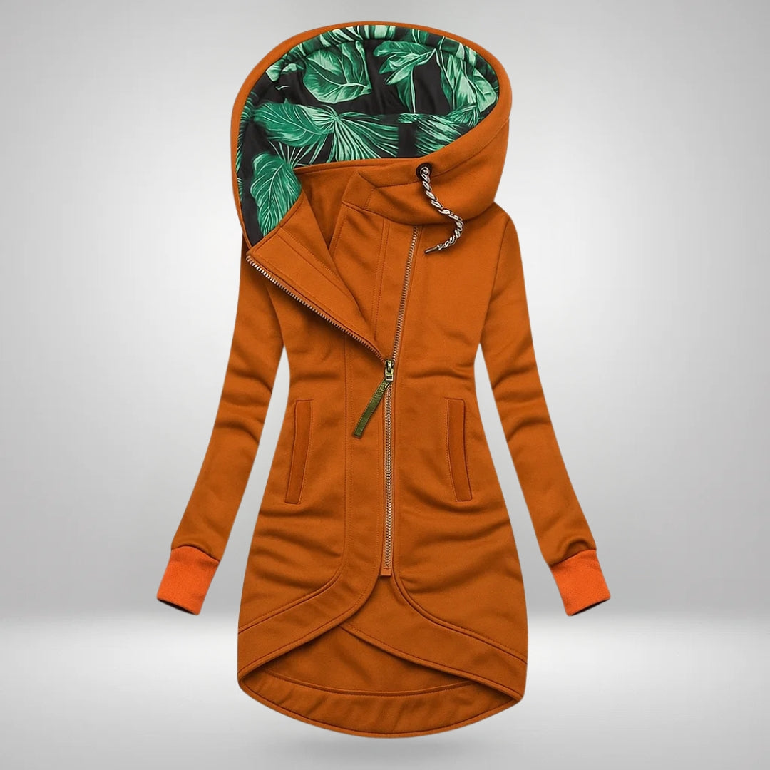 Women’s winter coat in orange, zip-front hood with green leafy inner lining