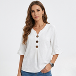 White linen-look blouse with V-neck, three-button front, and flared 3/4 sleeves