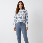 Blue heart-print crewneck sweater and slate-blue jogger pants with drawstring waist