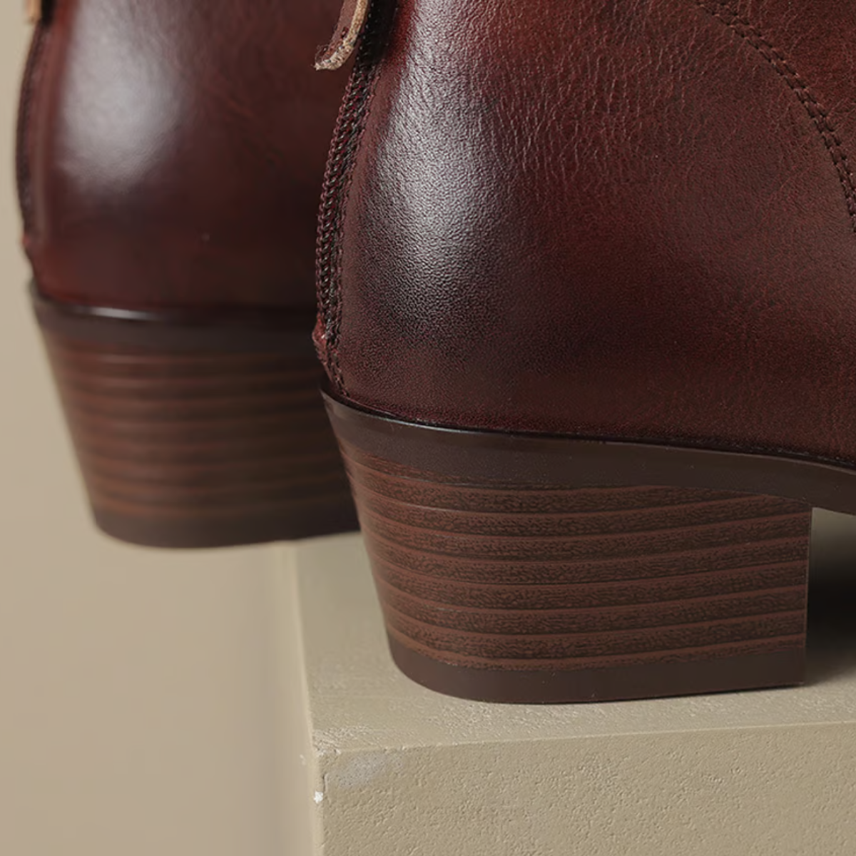 Brown ankle boot heel close-up, low block heel with textured sole