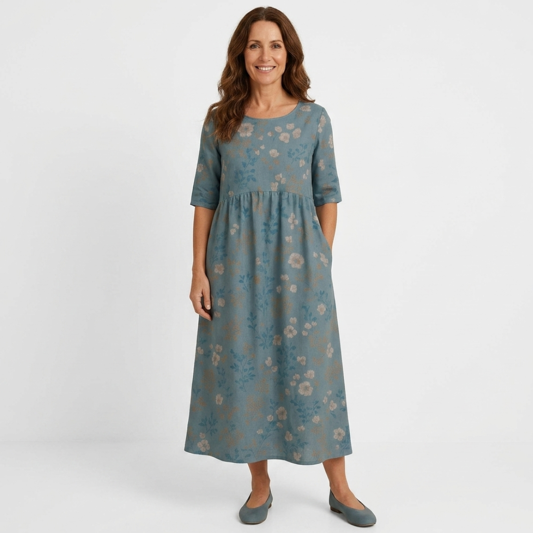 Casual midi dress in teal blue with tan floral print, half sleeves, gathered waist