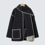 Dark gray wool coat with integrated scarf, white contrast trim, two front flap pockets