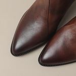 Elegant small-heel ankle boots in dark brown leather, rounded toe and studded trim