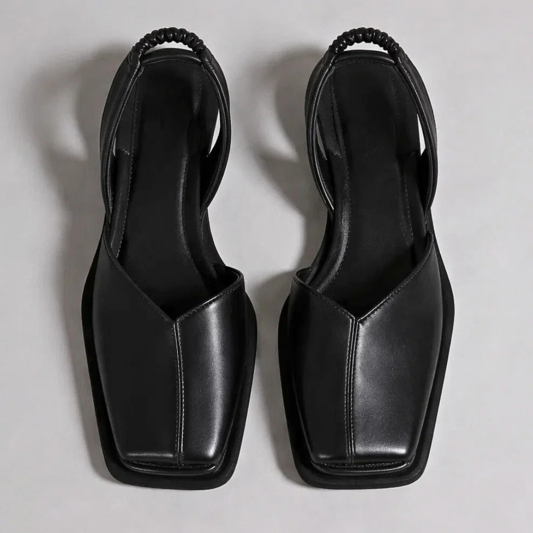 Pair of Emanuela square-toe moccasins in black with black trim and outsole