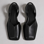 Pair of Emanuela square-toe moccasins in black with black trim and outsole