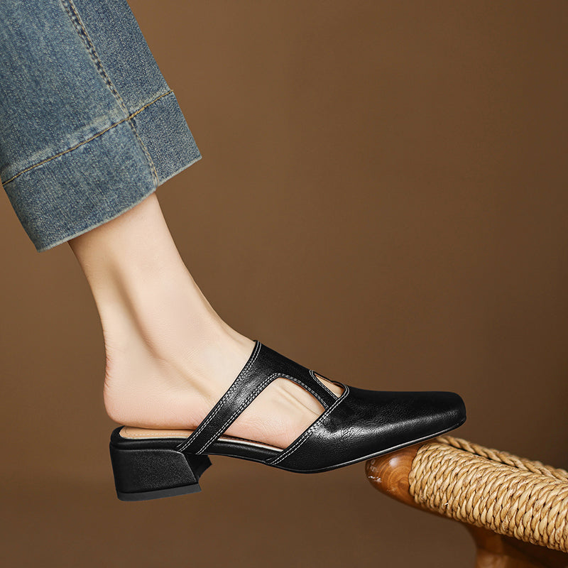 Black natural leather mule flats with low block heel and ankle cutout strap detail