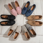 Assorted suede-look slip-on loafer shoes in pink, navy, black, tan, cream, and gray