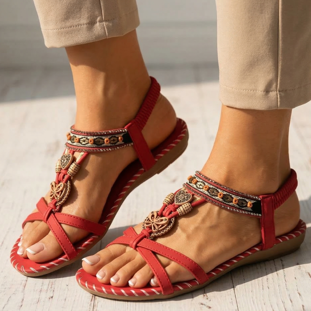 Red orthopedic sandals with ankle straps and decorative charm bead trim