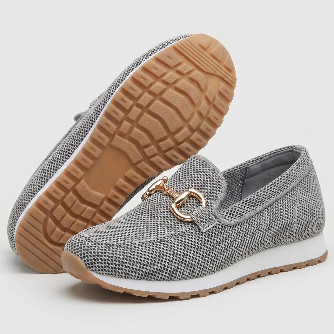 Dark gray orthopedic moccasin shoes with gold-tone horsebit, outsole and side view