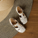 Beige natural leather sandals with open toe and buckle ankle strap