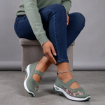 Green knit slip-on orthopedic shoes with ankle chain strap and floral embroidery detail