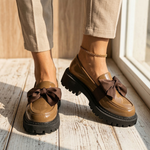 Water-resistant loafers in dark brown with bow detail and chunky rubber sole
