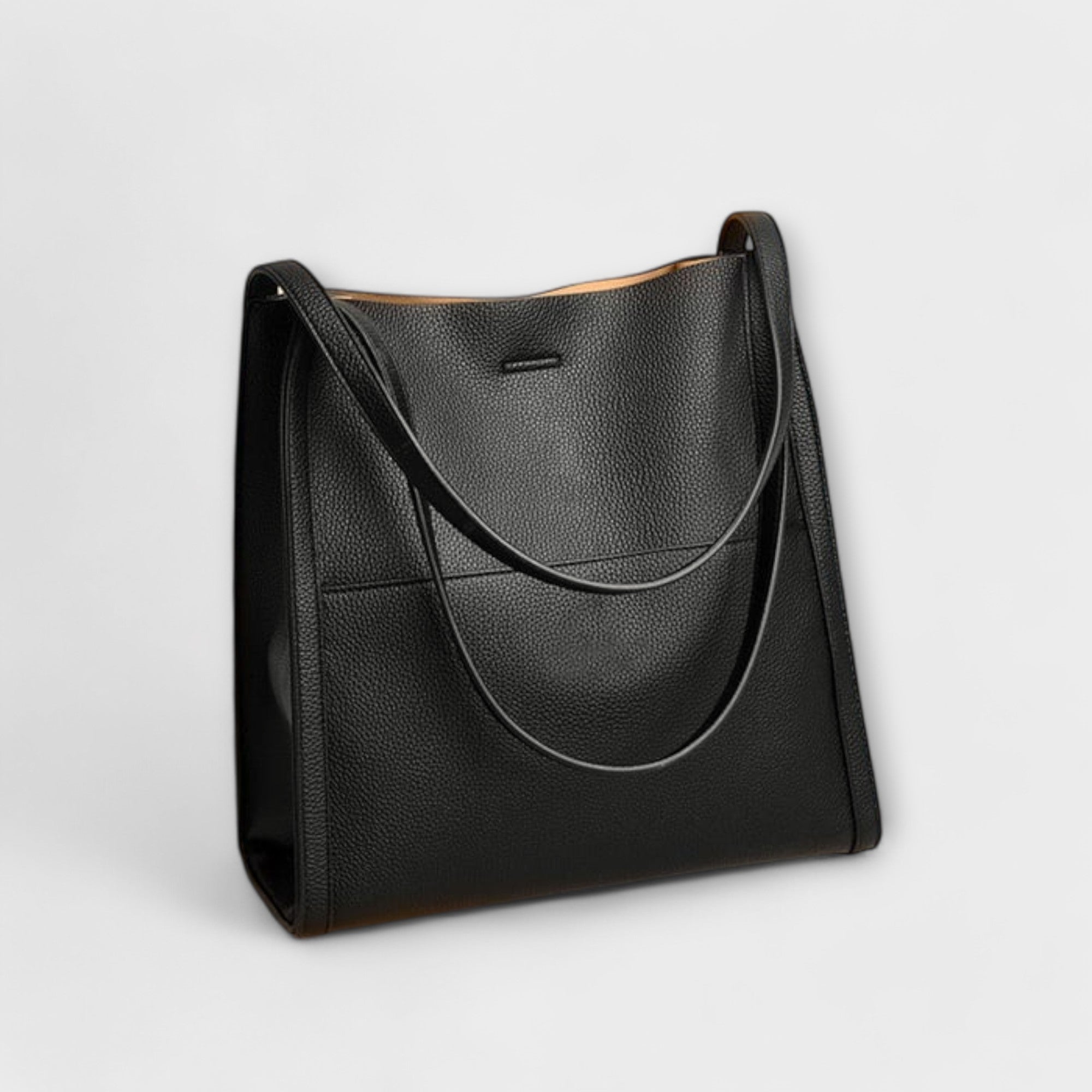 Natural leather tote bag, dark color, wide open top with long shoulder handles.
