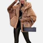 Oversized tan quilted hooded jacket with patchwork panels and ribbed cuffs