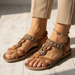 Tan orthopedic sandals with ankle straps and decorative charm bead trim