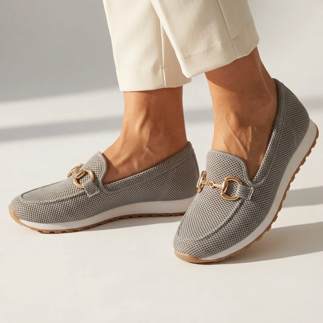 Dark gray orthopedic moccasin shoes with gold-tone horsebit and textured fabric upper