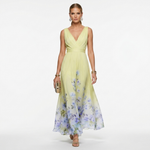 Pale yellow chiffon floral maxi dress with V-neckline and sleeveless fitted waist