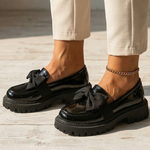 Water-resistant loafers in black with knotted bow and platform-style tread