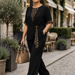 Black two-piece pantsuit with V-neck top and leopard-print tie detail