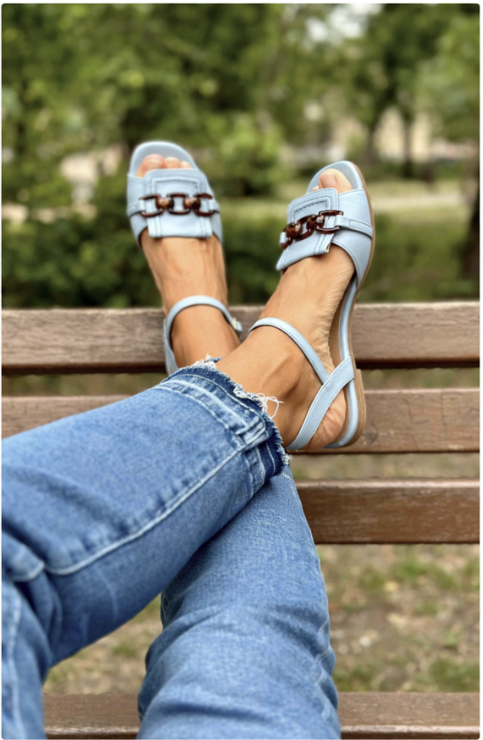 Light blue double-buckle sandals with ankle strap and block heel, side view