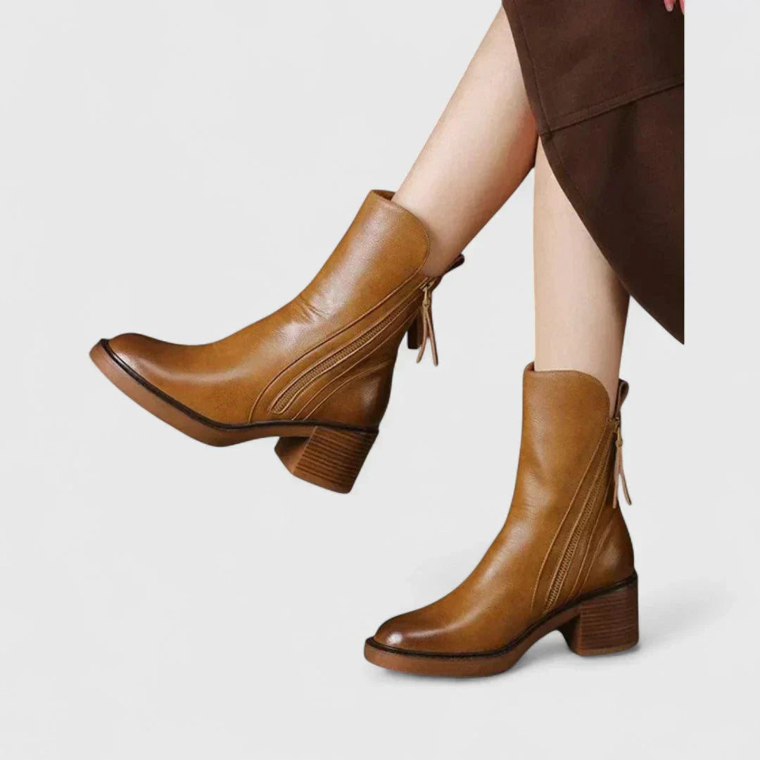 Tan leather ankle boots with side zipper, tassel ties, and block heel