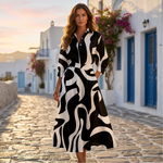 Elegant cotton dress with pointed collar, long sleeves, black and white abstract pattern