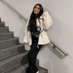 White sherpa zip-up winter jacket with stand collar and two front flap pockets