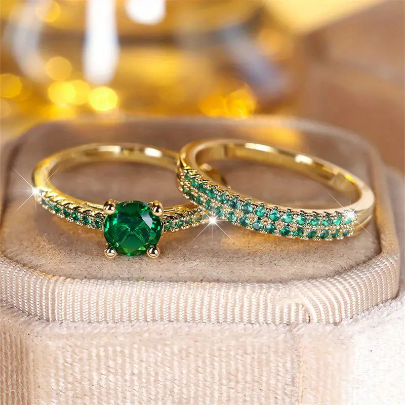 Gold-tone ring set on cushion: oval green gemstone prong setting and green pave band