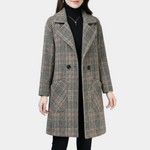 Double-breasted plaid coat with notched lapels, long sleeves, and two front pockets, dark buttons