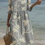 Women's midi dress in light gray with white botanical floral pattern and gathered waist
