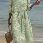 Light green midi dress with white botanical floral embroidery, 3/4 sleeves, round neck