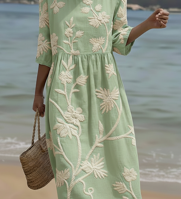 Light green midi dress with white botanical floral embroidery, 3/4 sleeves, round neck