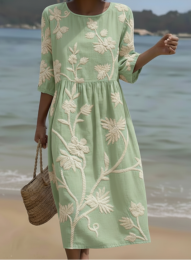 Light green midi dress with white botanical floral embroidery, 3/4 sleeves, round neck