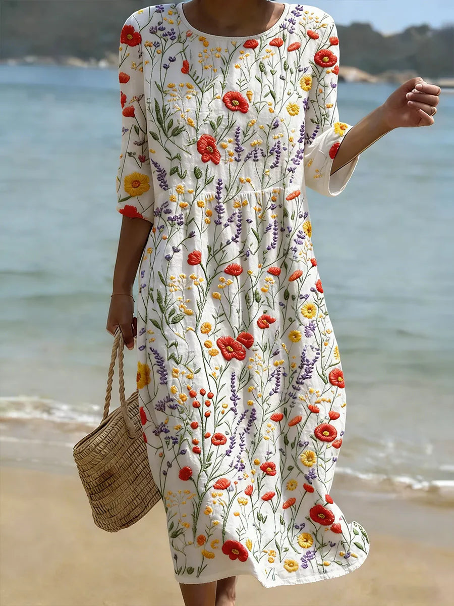 Floral print dress with short sleeves, round neckline, and gathered skirt on white base
