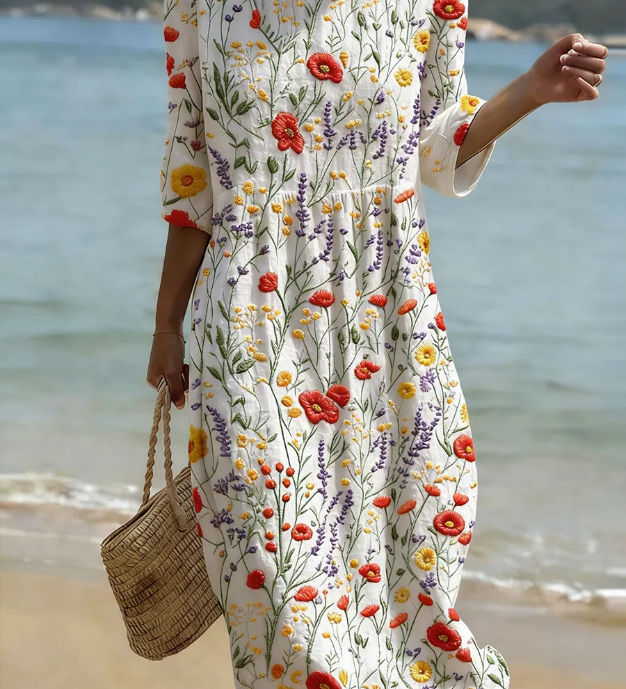 Floral print dress with short sleeves, round neckline, and gathered skirt on white base