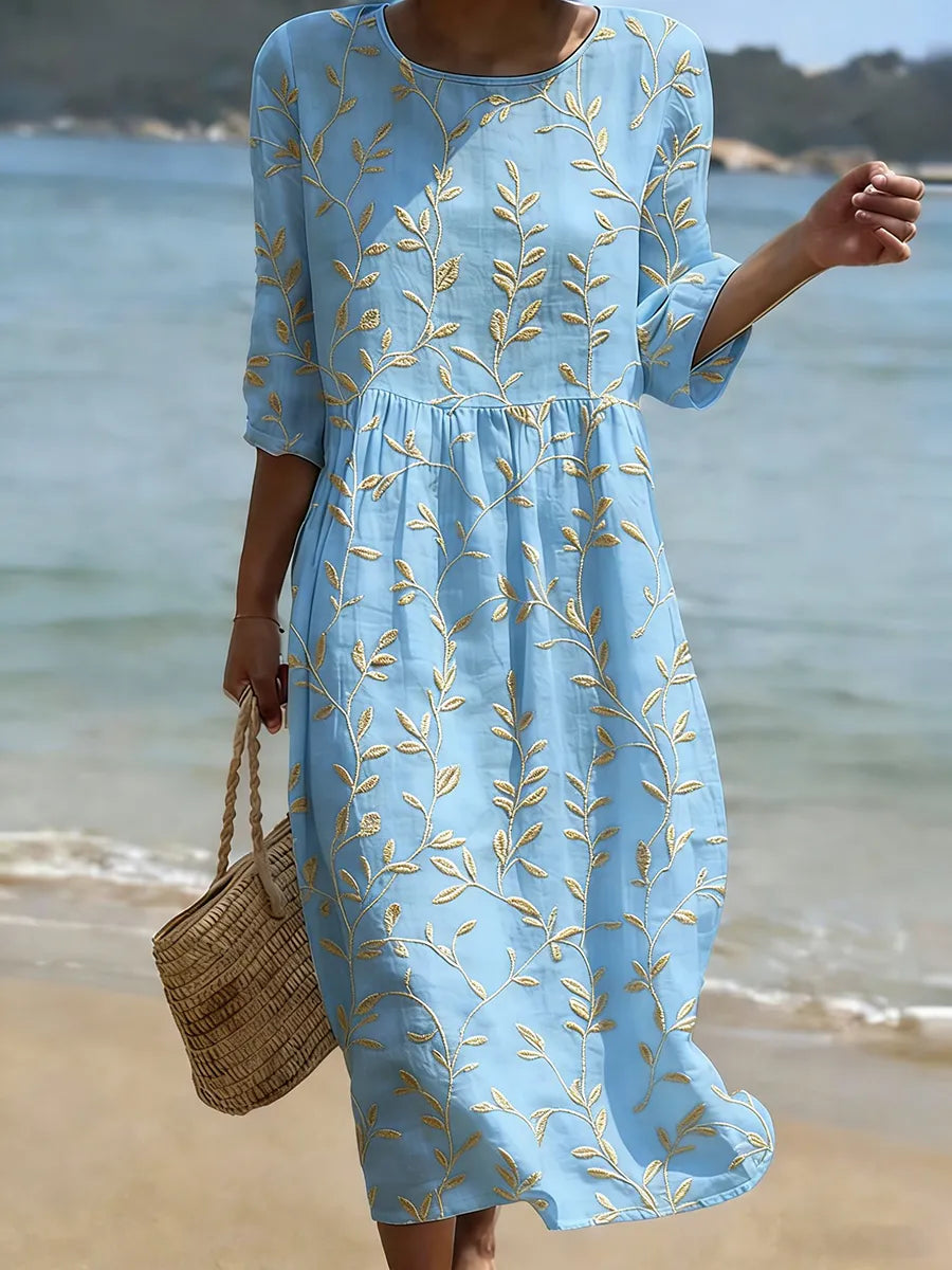 Natalie midi dress in light blue with yellow plant and flower print, round neckline