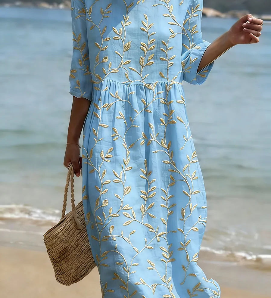 Natalie midi dress in light blue with yellow plant and flower print, round neckline