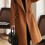 Camel winter coat with notch lapels, front buttons, and waist belt