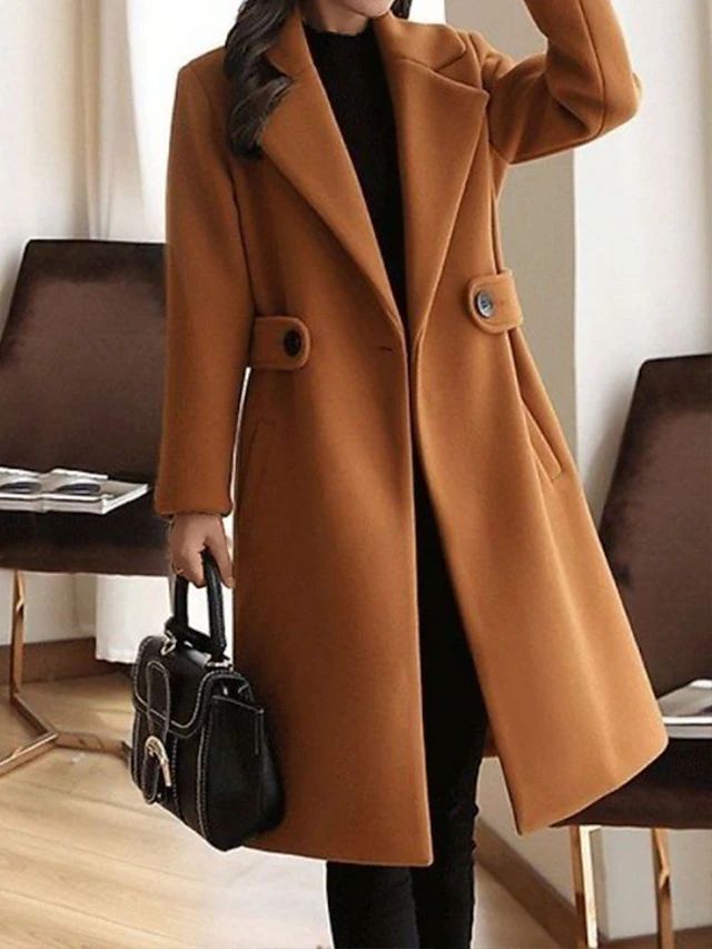 Camel winter coat with notch lapels, front buttons, and waist belt
