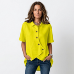 Bright yellow asymmetric button-up blouse with short sleeves, point collar, curved hem detail
