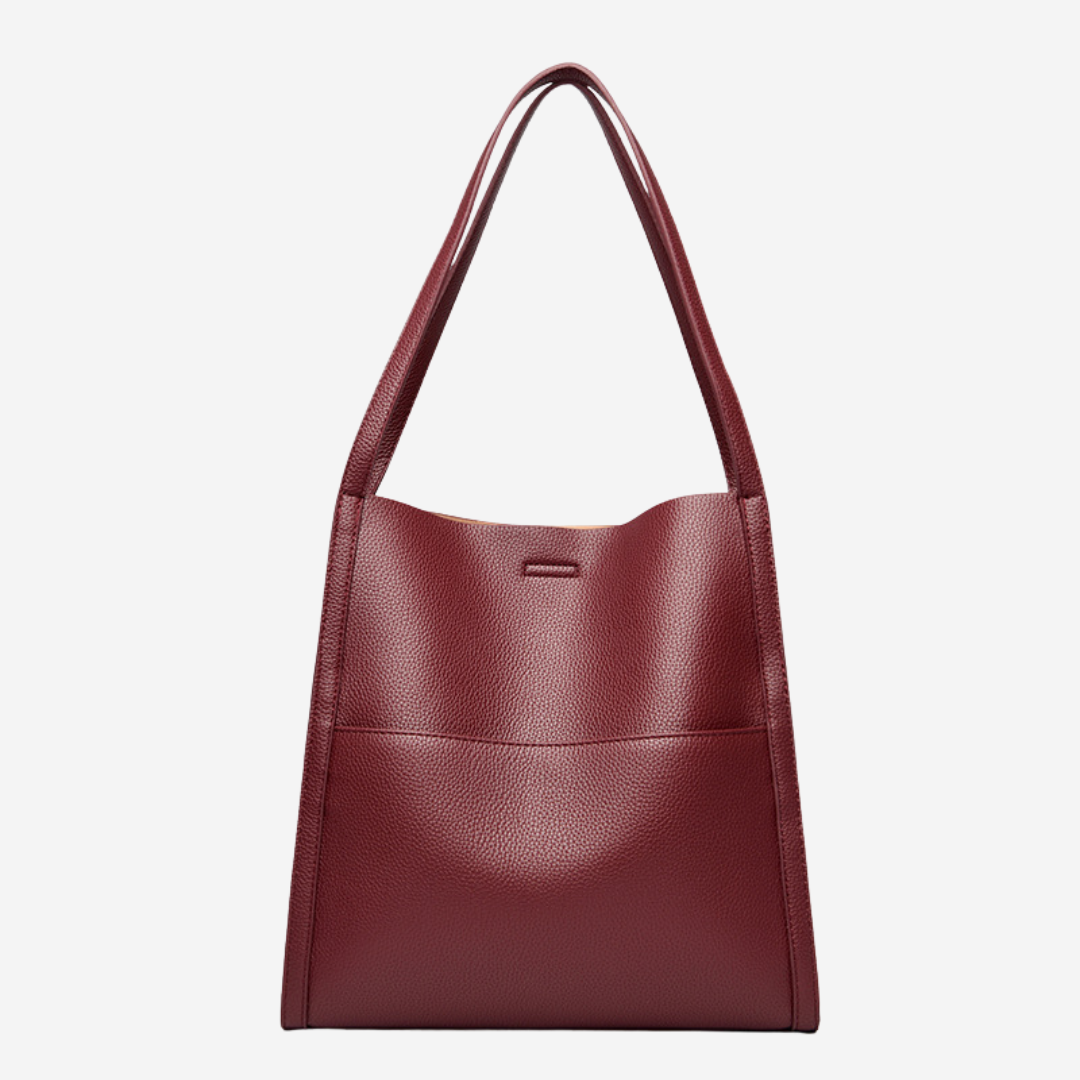Red textured shoulder bag with top handles and front seam detail