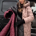 Two-tone quilted hooded puffer coat in beige, pink, and dark panels