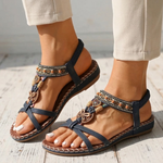 Navy orthopedic sandals with toe loop straps and ornate charm bead trim