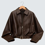 Brown oversized zip-up jacket with pointed collar and snap belt hem